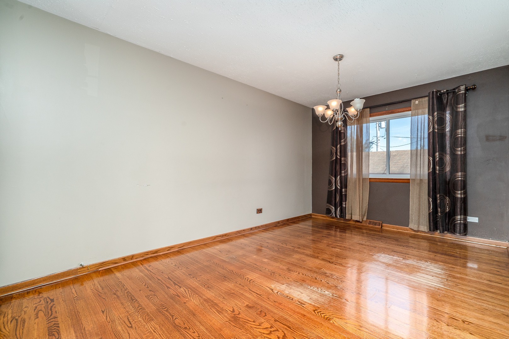 1425 Douglas Lane Crete, IL 60417 - Photo 5 of 19 a view of a big room with windows and chandelier