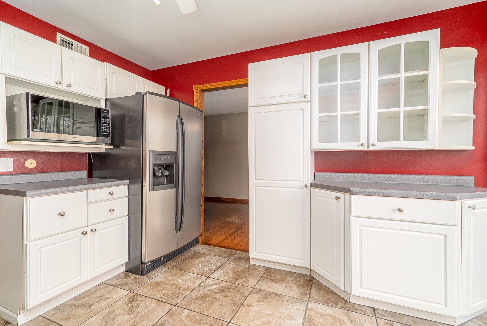 1425 Douglas Lane Crete, IL 60417 - Photo 8 of 19 a kitchen with white cabinets and refrigerator