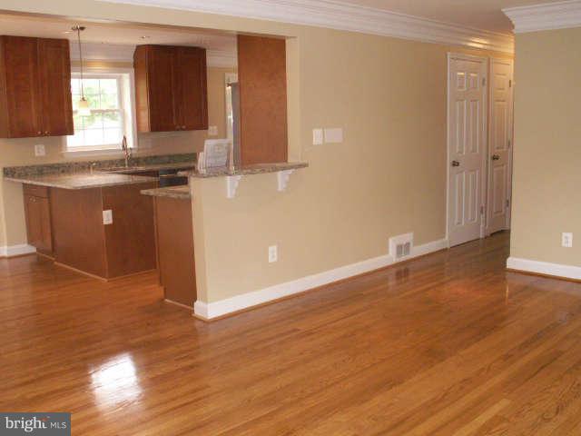 5919 Hanover Avenue Springfield, VA 22150 - Photo 5 of 29 a view of a kitchen with wooden floor and a window