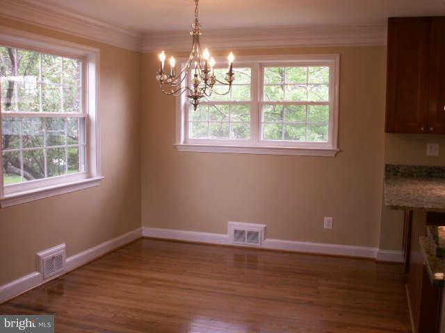 5919 Hanover Avenue Springfield, VA 22150 - Photo 8 of 29 a view of a livingroom with wooden floor a chandelier and window