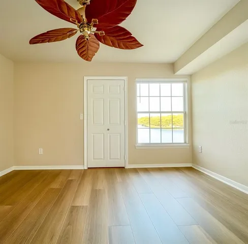 a view of room with wooden floor and window