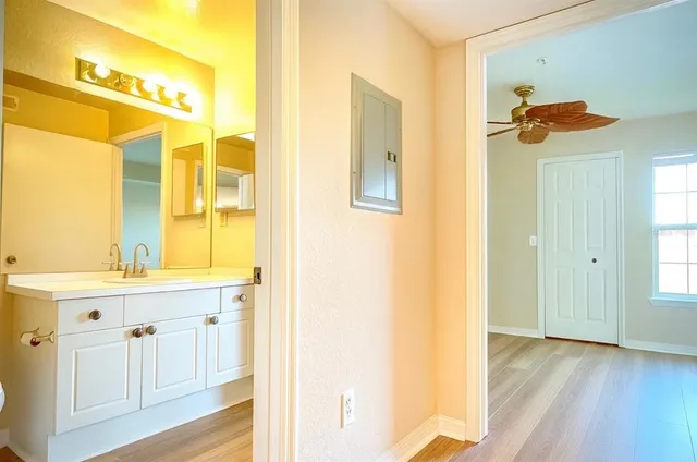 a bathroom with a sink a mirror and a shower