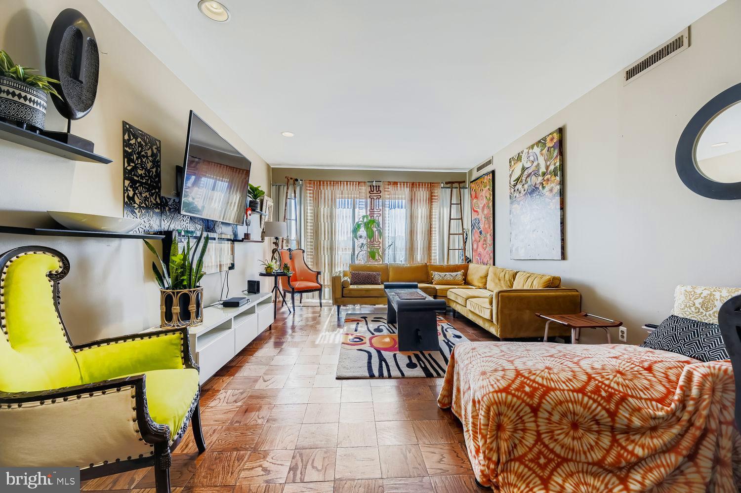 3601 Clarks Lane, Unit 508 Baltimore, MD 21215 - Photo 13 of 24 a bed room with a bed and a chair