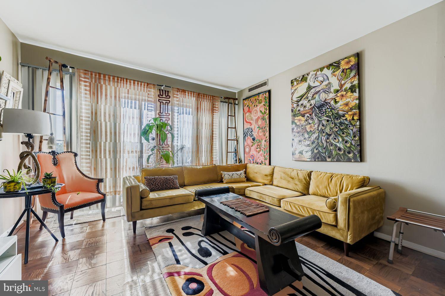 3601 Clarks Lane, Unit 508 Baltimore, MD 21215 - Photo 14 of 24 a living room with furniture and a large window