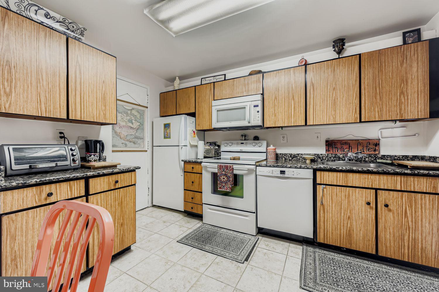 3601 Clarks Lane, Unit 508 Baltimore, MD 21215 - Photo 17 of 24 a kitchen with stainless steel appliances granite countertop a sink and cabinets