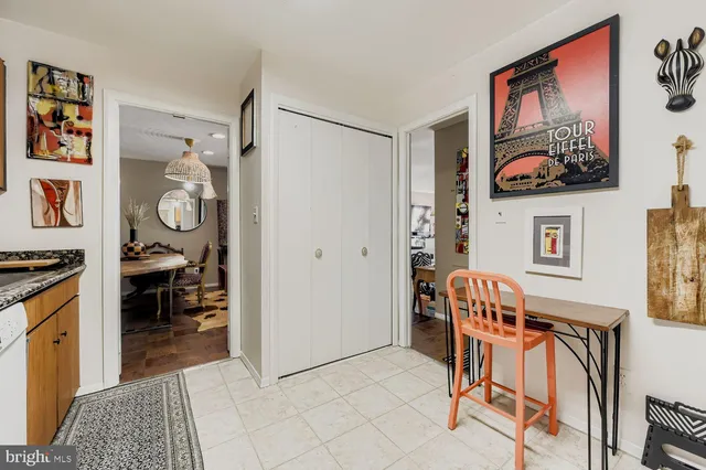 a living room with furniture and next to a window