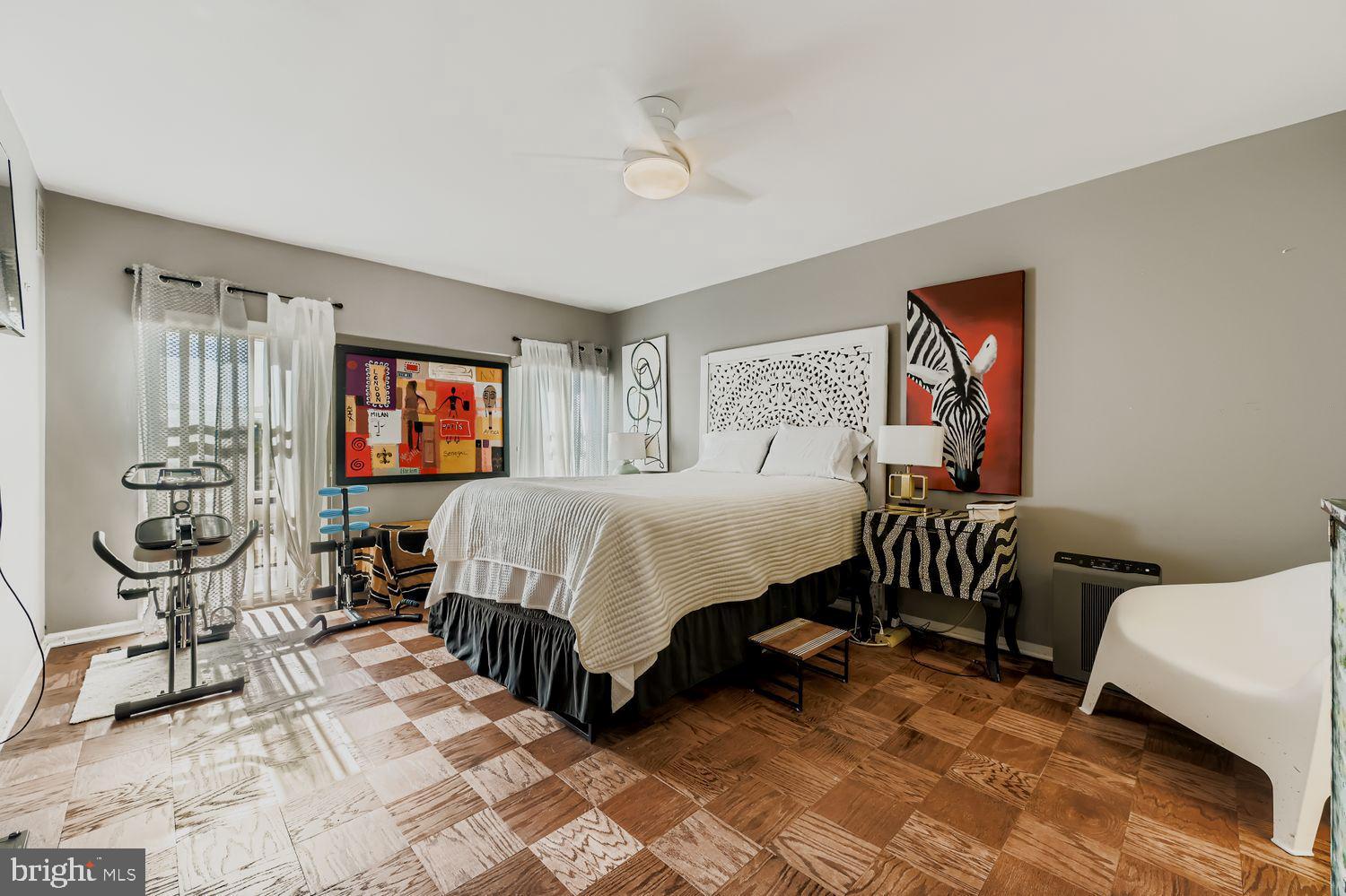 3601 Clarks Lane, Unit 508 Baltimore, MD 21215 - Photo 19 of 24 a bedroom with a bed a couch and dresser