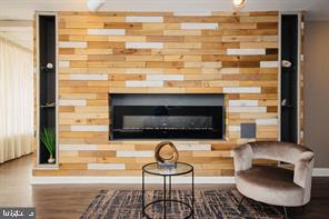 3601 Clarks Lane, Unit 508 Baltimore, MD 21215 - Photo 5 of 24 a living room with furniture and a fireplace