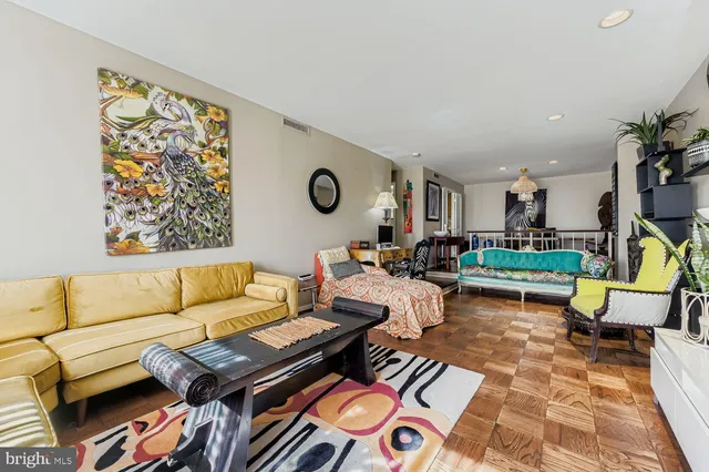 a living room with furniture and a rug