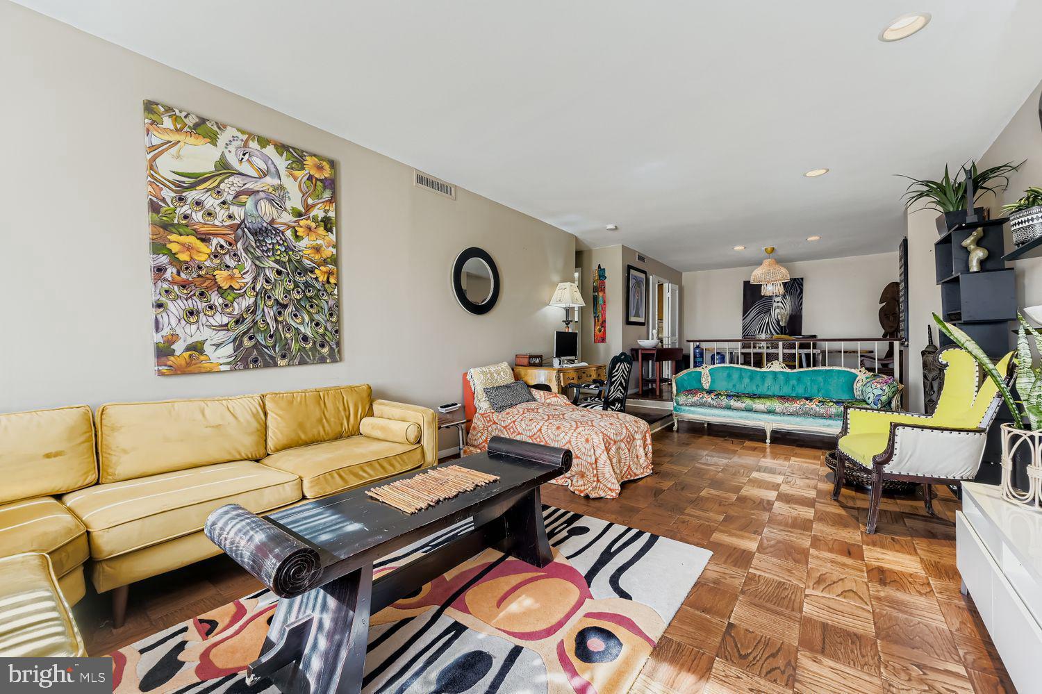 3601 Clarks Lane, Unit 508 Baltimore, MD 21215 - Photo 10 of 24 a living room with furniture and a rug