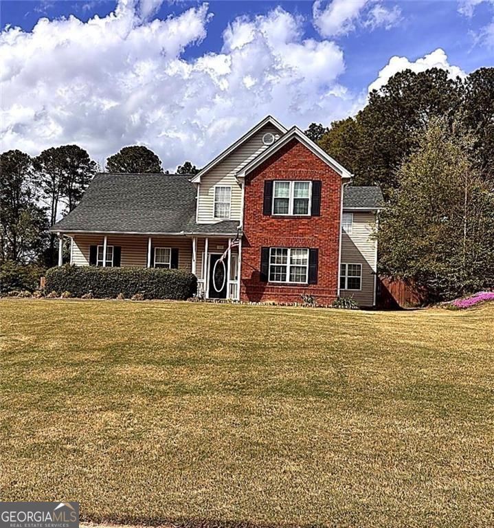 543 Saddle Ridge Drive Bethlehem, GA 30620 - Photo 1 of 36 a front view of a house with a yard
