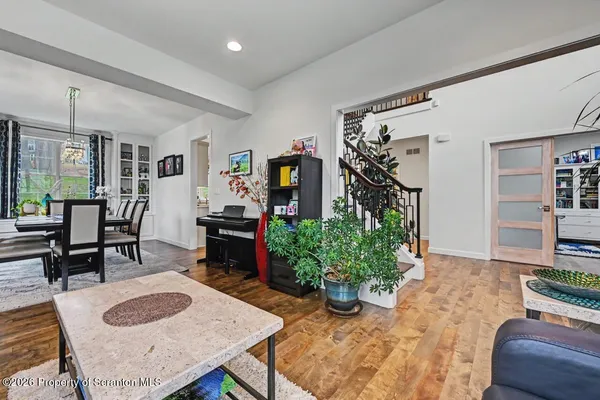 a view of a dining room with furniture window and wooden floor