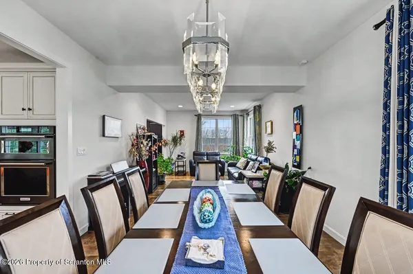 a kitchen with stainless steel appliances kitchen island granite countertop a sink and cabinets