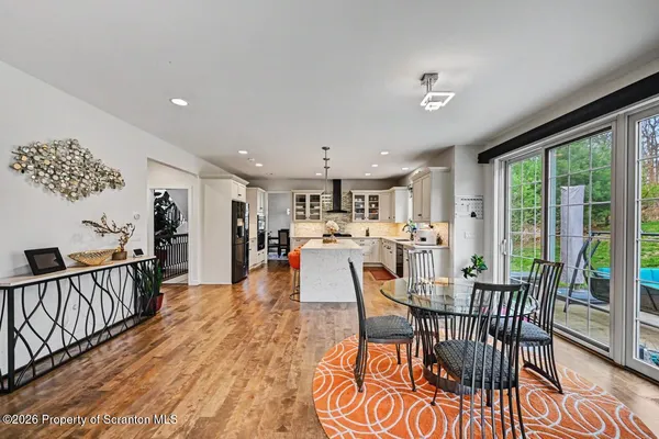 a living room with furniture and floor to ceiling window
