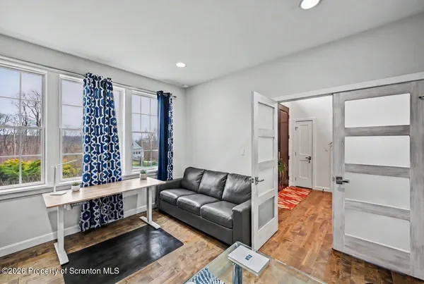 a bathroom with a shower curtain and window