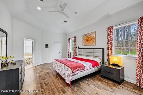 a living room with furniture gym equipment and a flat screen tv