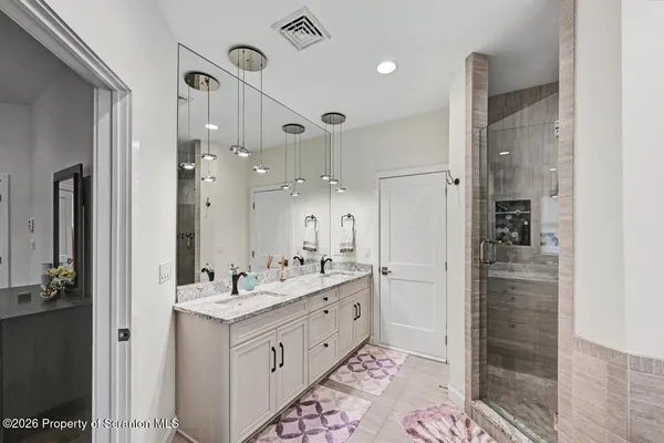 a kitchen that has a sink and a stove in it