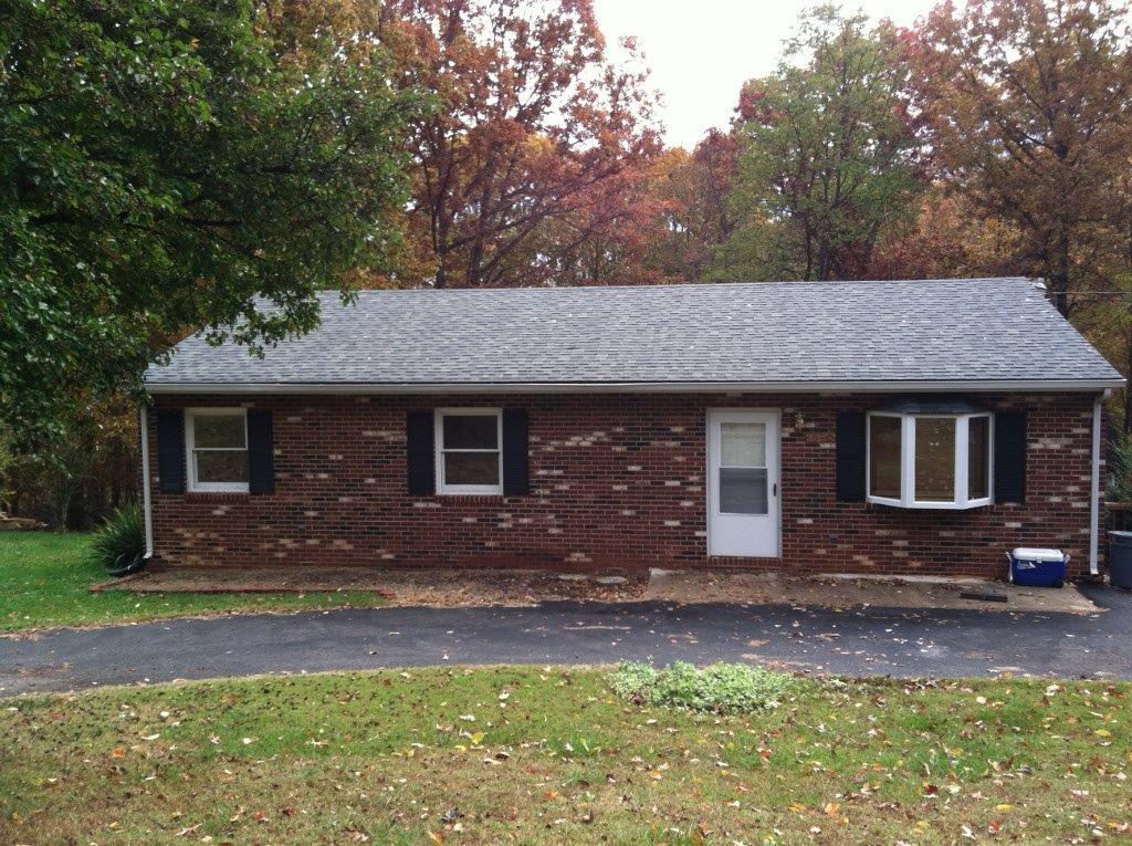 1650 Turner Branch Road Goodview, VA 24095 - Photo 1 of 48 a front view of a house with garden