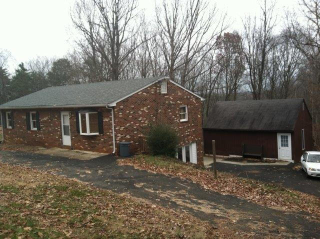 1650 Turner Branch Road Goodview, VA 24095 - Photo 4 of 48 a front view of a house with a yard