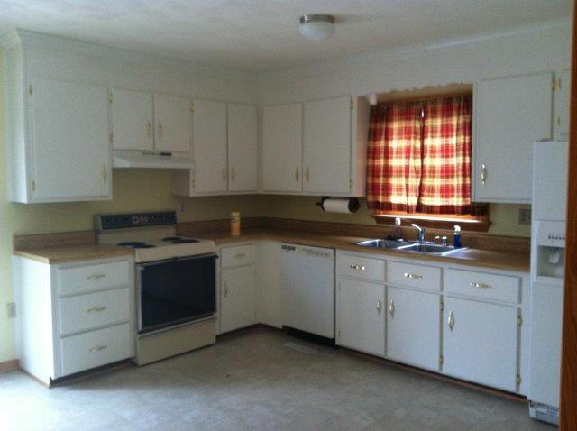1650 Turner Branch Road Goodview, VA 24095 - Photo 10 of 48 a kitchen with granite countertop white cabinets and a stove