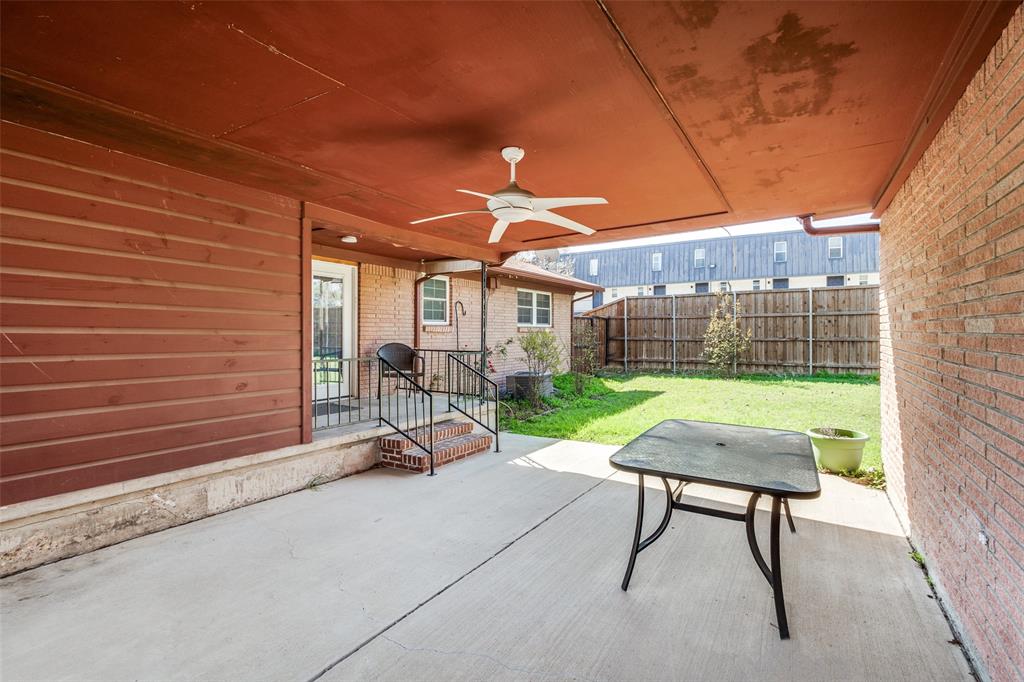 433 Fulton Street Denton, TX 76201 - Photo 21 of 25 a patio with table and chairs