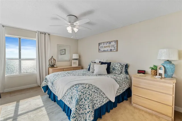 a bedroom with bed and a window