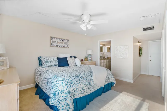 a bedroom with bed and window