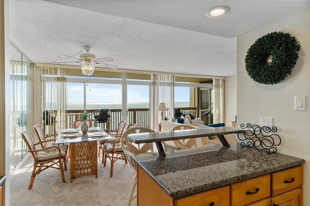 a view of a dining room with furniture window and outside view