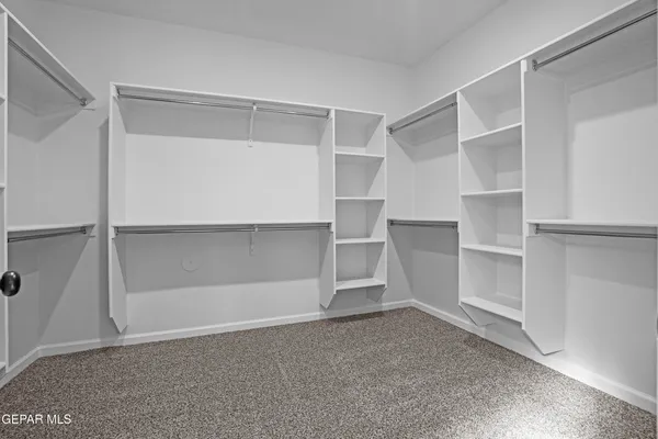 a view of an empty walk in closet
