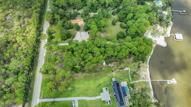 a backyard of a house with a yard and outdoor seating