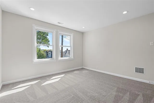 a kitchen with a sink cabinets and a window