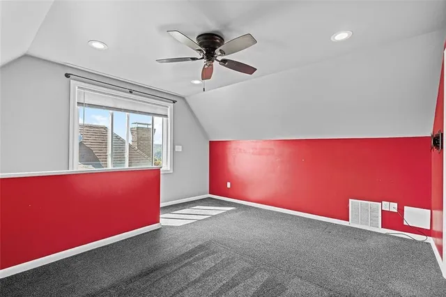 a view of room with window and ceiling fan