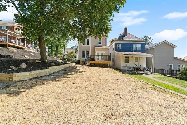 a view of a house with snow on the road