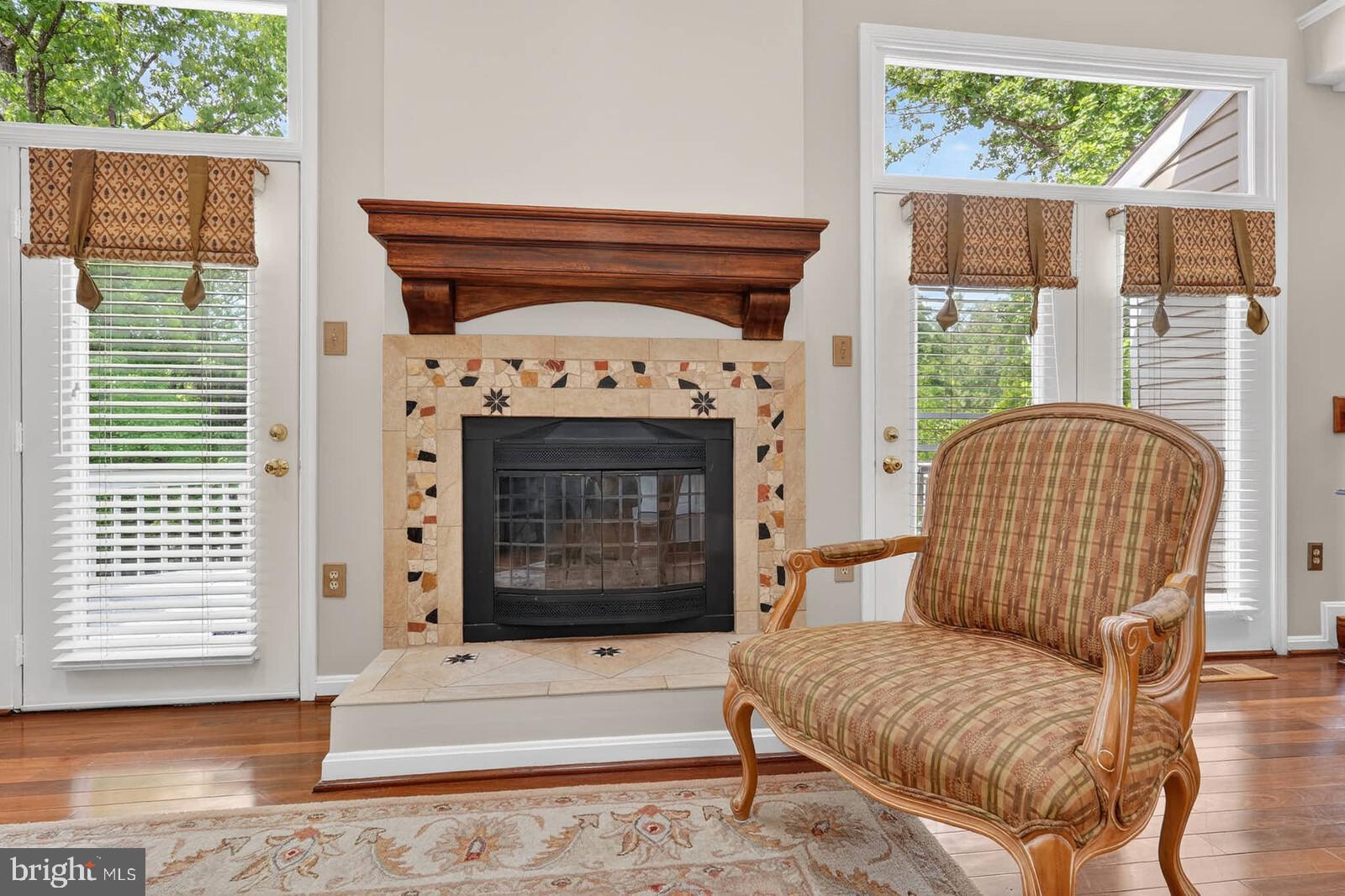 2108 Merrifields Drive Silver Spring, MD 20906 - Photo 21 of 69 a living room with furniture a fireplace and a large window