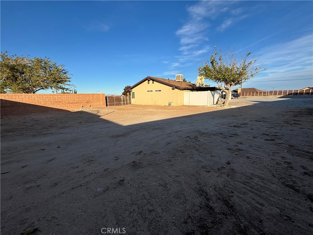 15137 Luna Road Victorville, CA 92392 - Photo 11 of 20 a view of a house with a yard