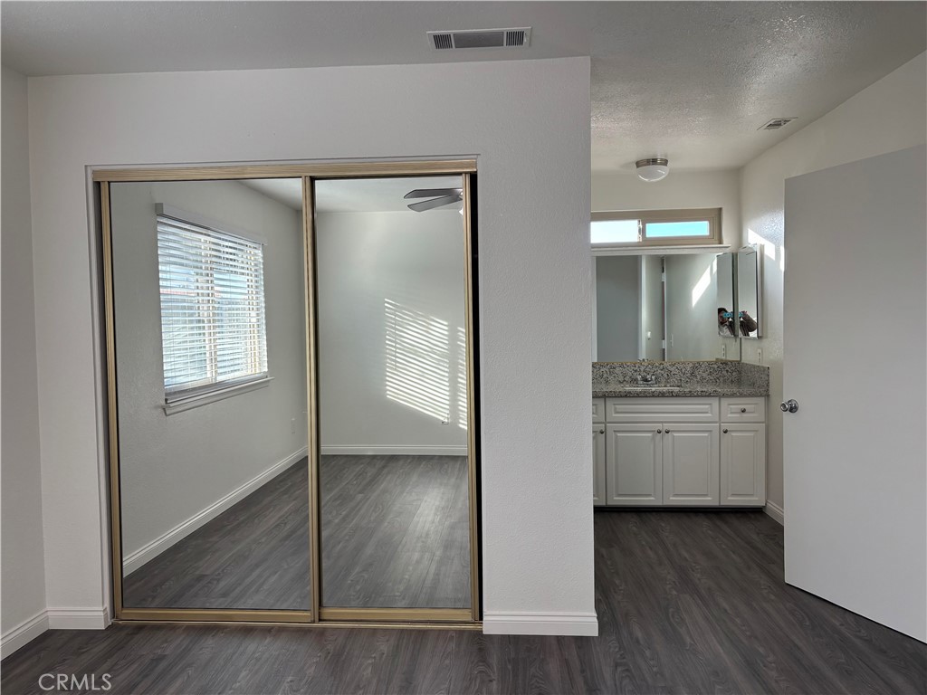 15137 Luna Road Victorville, CA 92392 - Photo 8 of 20 a bathroom with a granite countertop sink mirror and vanity