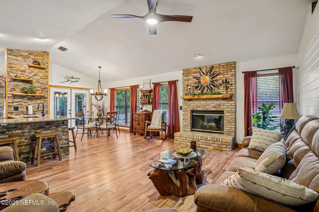 a living room with furniture and fireplace