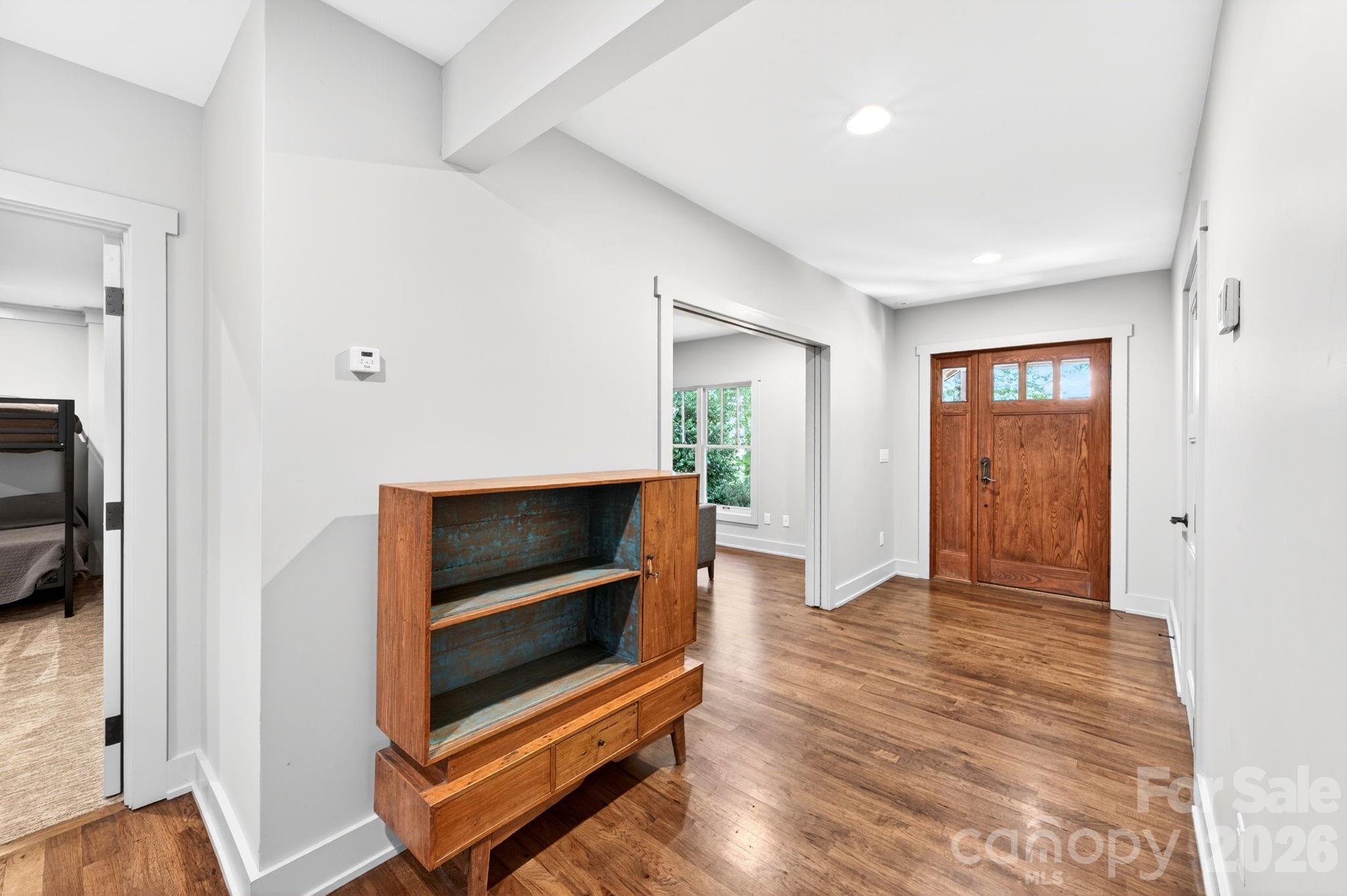 235 Bull Creek Road Asheville, NC 28805 - Photo 23 of 47 a living room with furniture and a flat screen tv