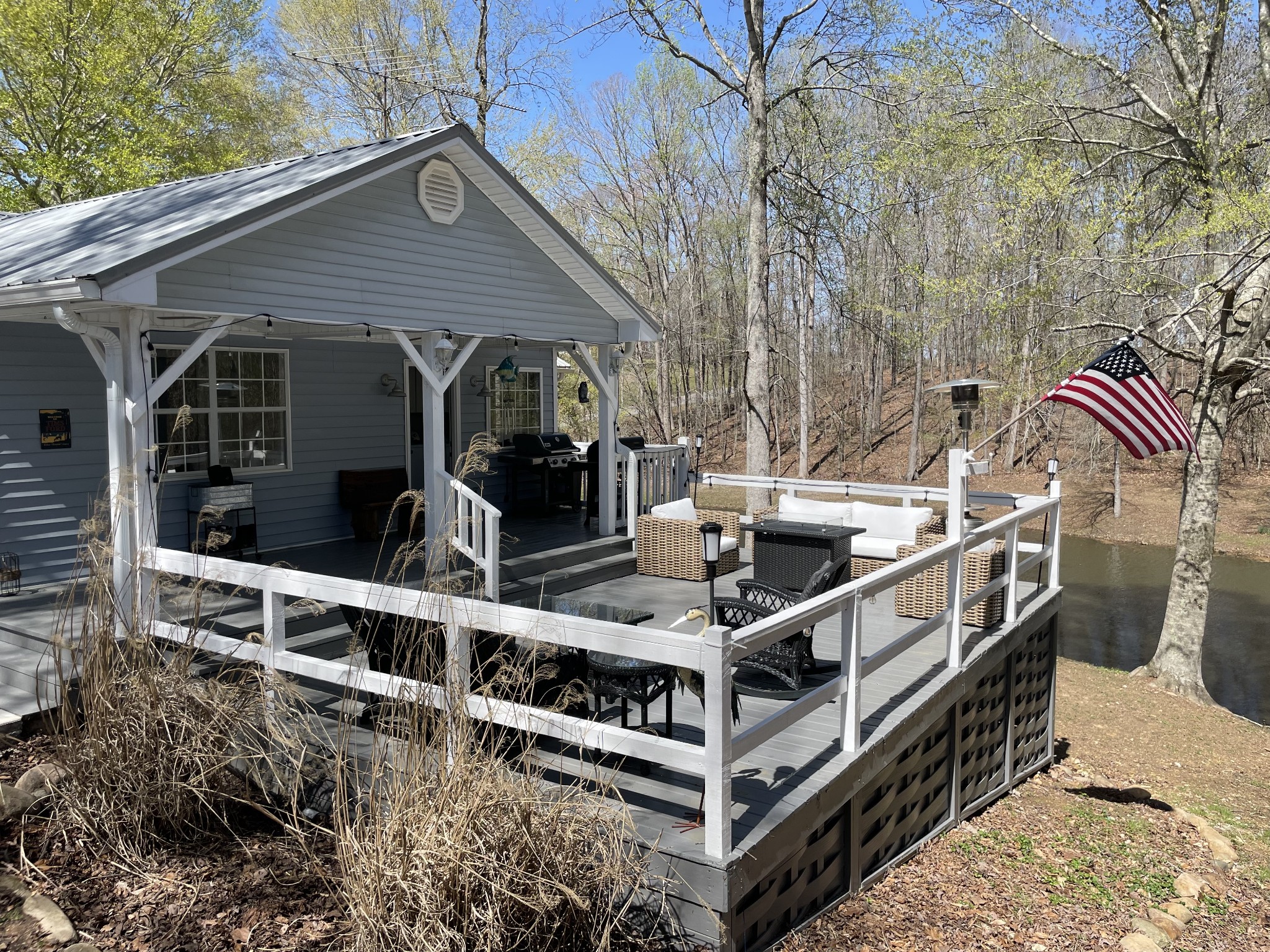 310 Shasteen Ridge Road Lynchburg, TN 37352 - Photo 14 of 36 a view of a balcony with chairs and wooden fence
