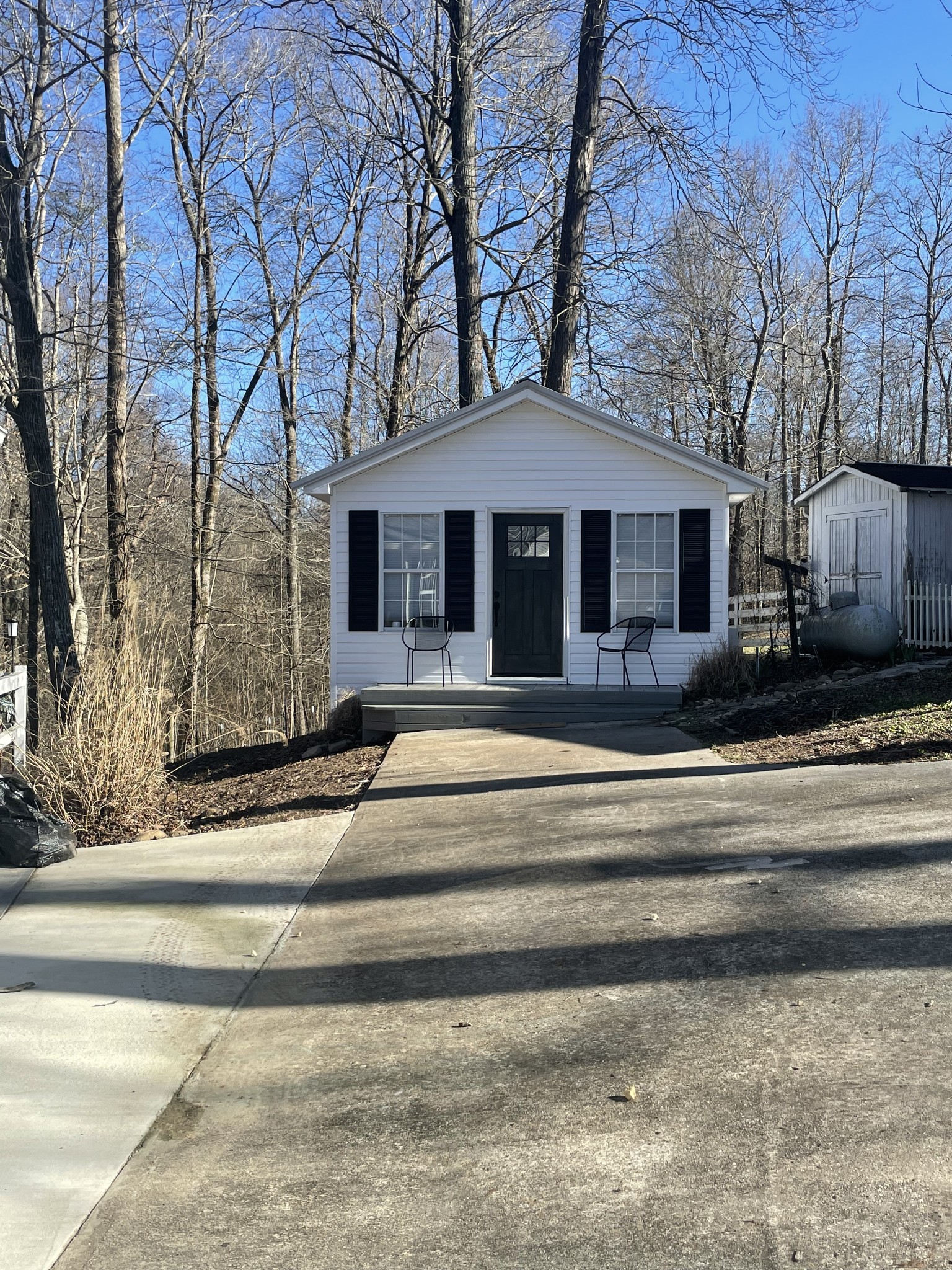 310 Shasteen Ridge Road Lynchburg, TN 37352 - Photo 18 of 36 a front view of a house with a yard