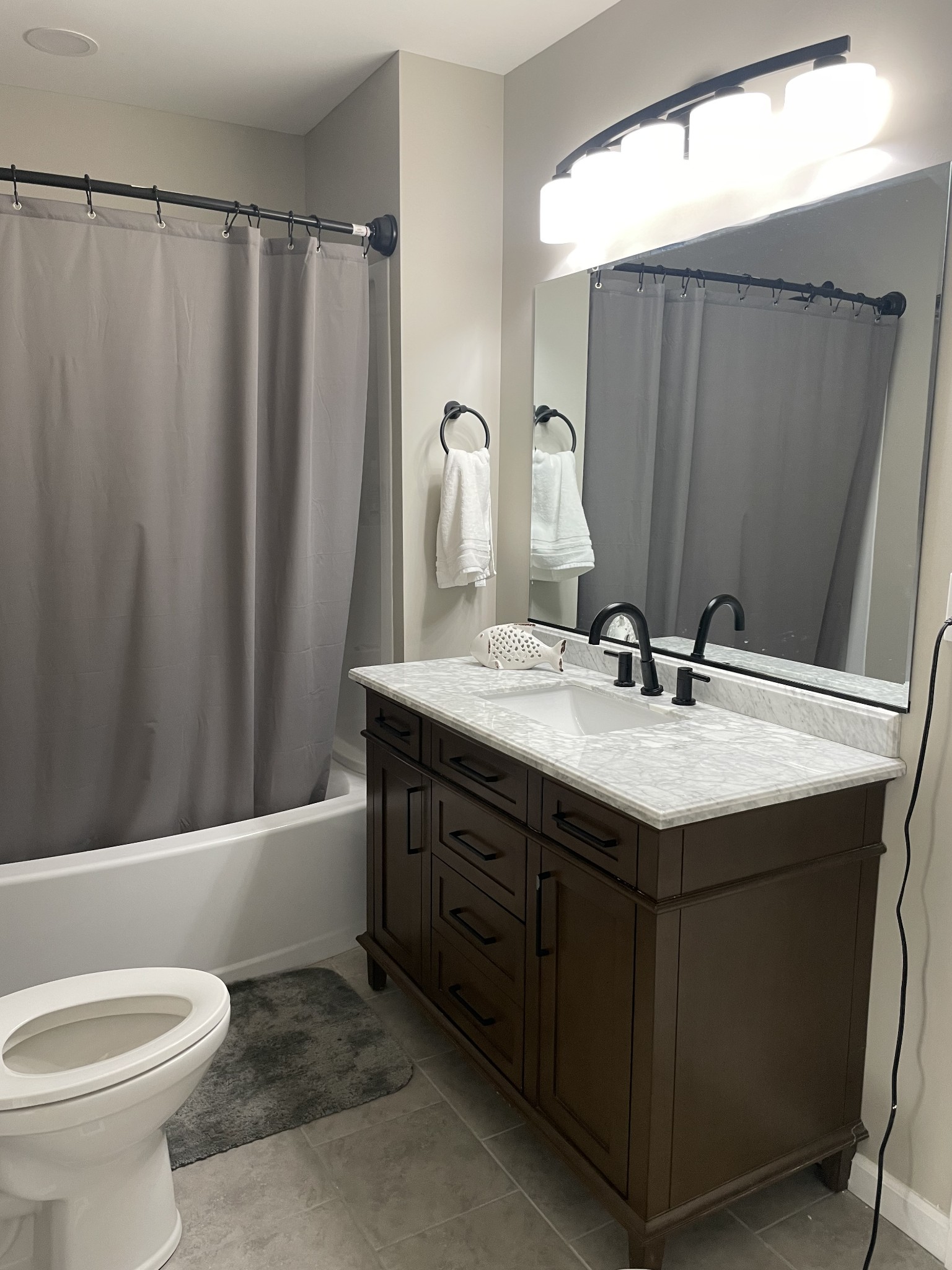 310 Shasteen Ridge Road Lynchburg, TN 37352 - Photo 24 of 36 a bathroom with a sink and a mirror