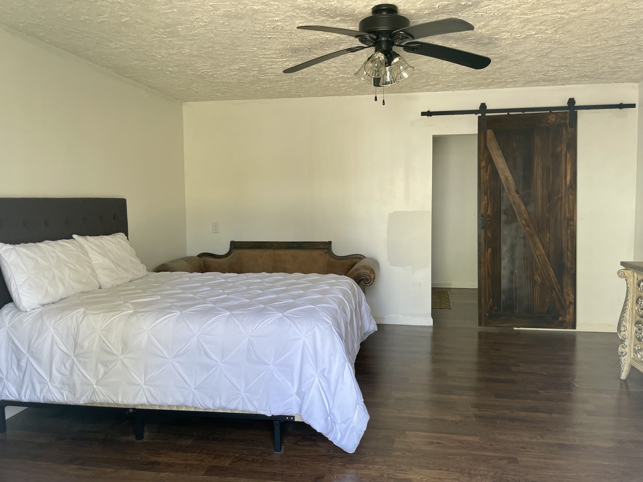 310 Shasteen Ridge Road Lynchburg, TN 37352 - Photo 26 of 36 a bedroom with a bed and wooden floor