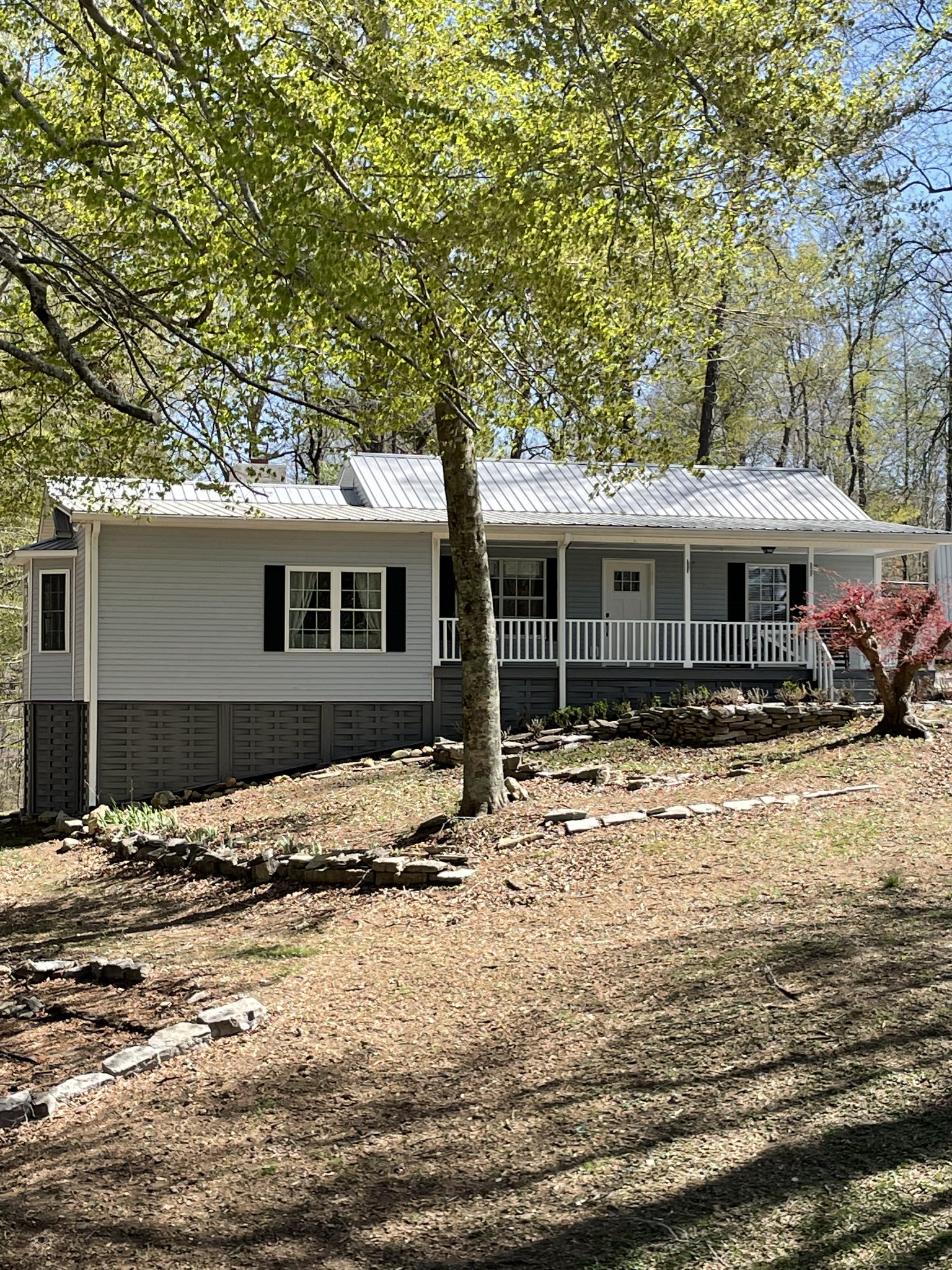 310 Shasteen Ridge Road Lynchburg, TN 37352 - Photo 30 of 36 a front view of a house with a yard