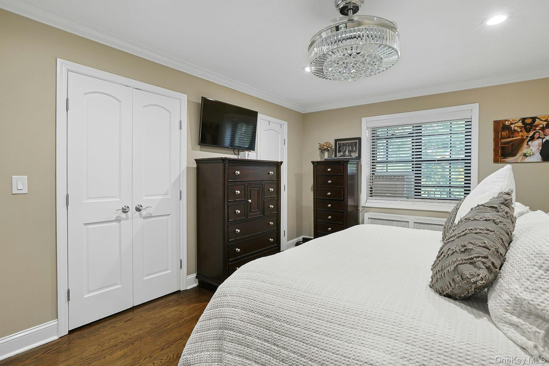 1245 California Road, Unit B23 Eastchester, NY 10709 - Photo 11 of 21 a bedroom with a bed and a window