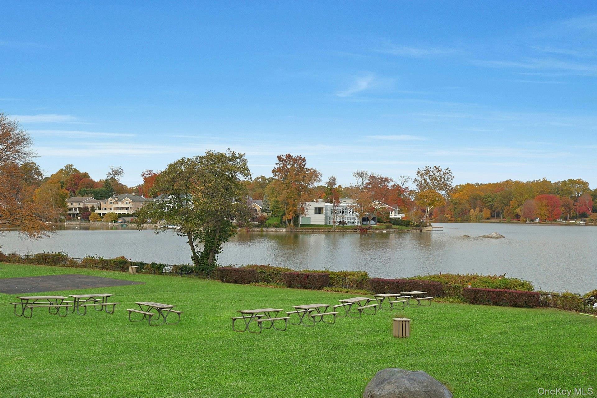 1245 California Road, Unit B23 Eastchester, NY 10709 - Photo 18 of 21 a view of a lake with houses in the back