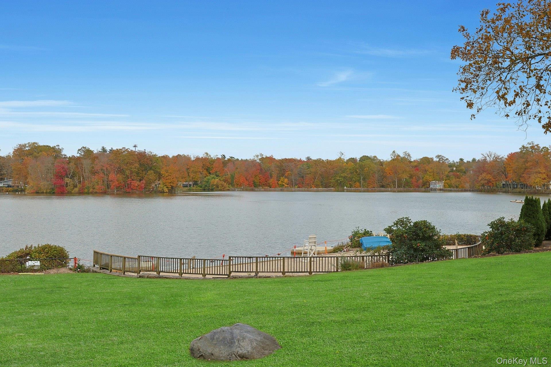1245 California Road, Unit B23 Eastchester, NY 10709 - Photo 19 of 21 a view of a lake with houses in background
