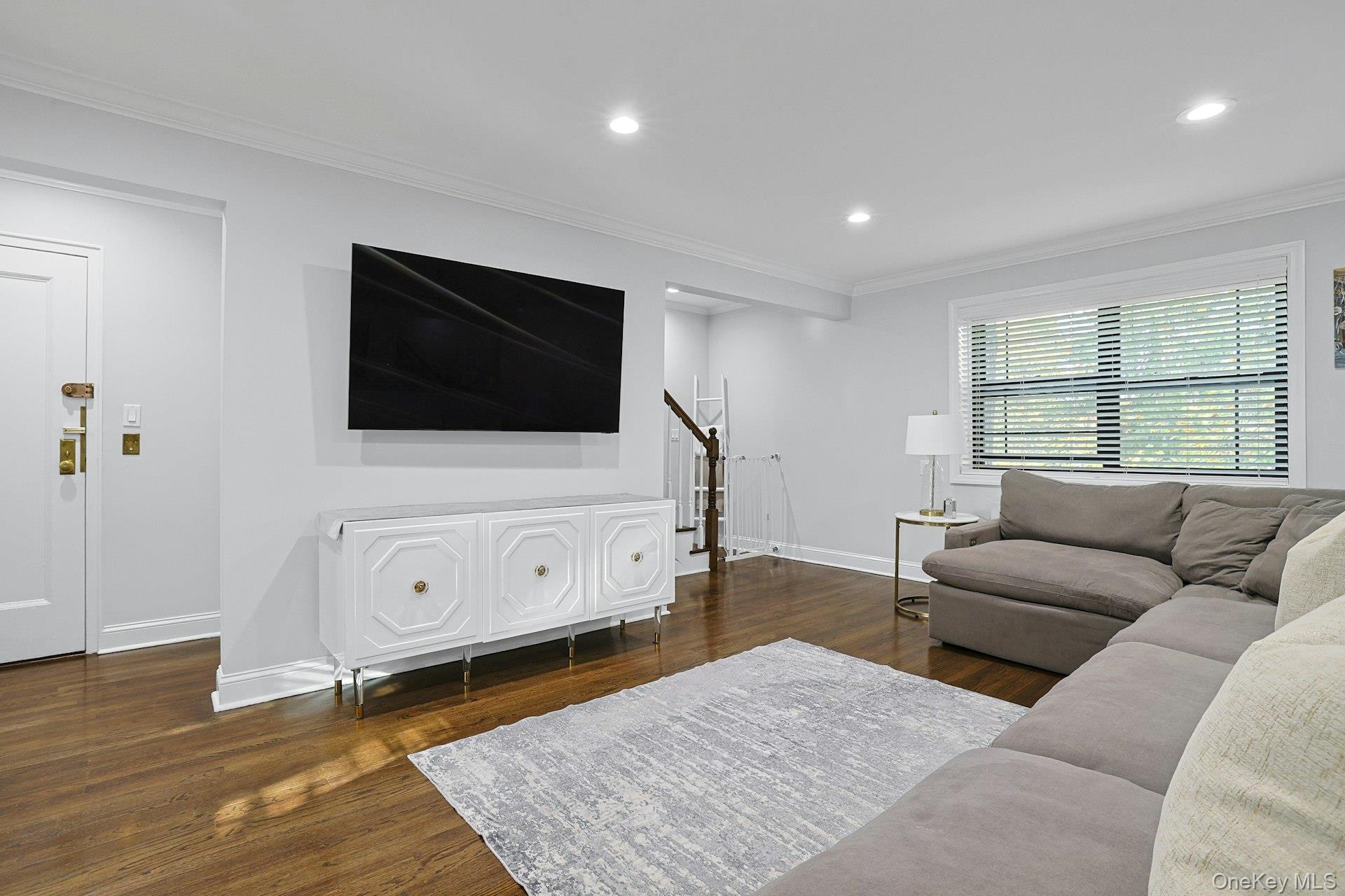 1245 California Road, Unit B23 Eastchester, NY 10709 - Photo 2 of 21 a living room with furniture and a flat screen tv
