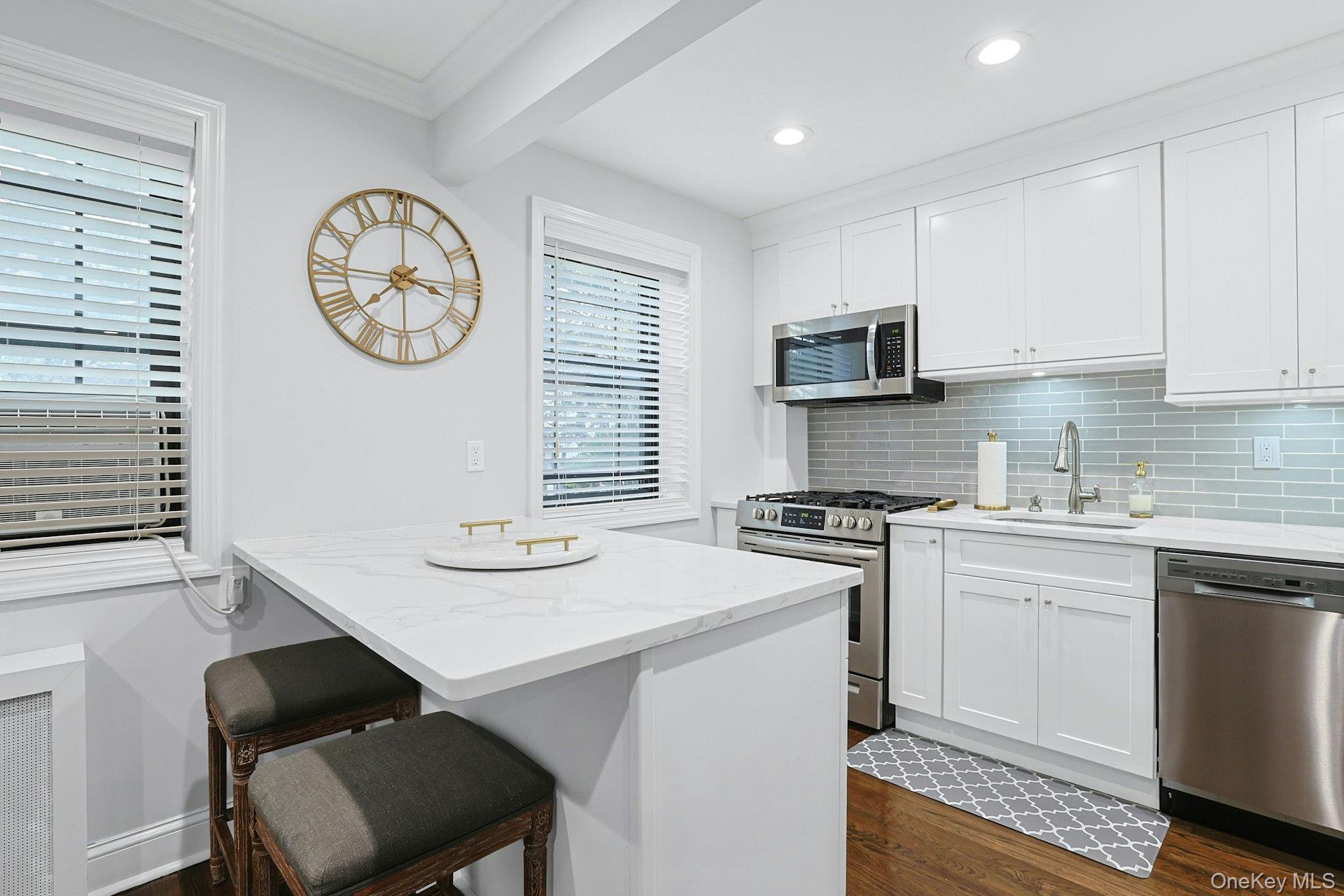 1245 California Road, Unit B23 Eastchester, NY 10709 - Photo 4 of 21 a kitchen with a stove cabinets and a refrigerator