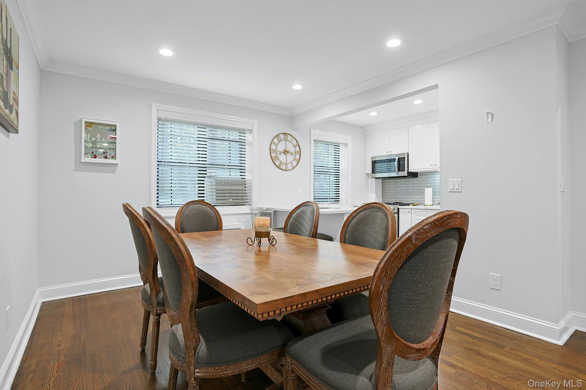 1245 California Road, Unit B23 Eastchester, NY 10709 - Photo 9 of 21 a view of a dining room with furniture and wooden floor