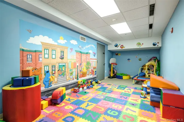 a bedroom with furniture and a baby crib